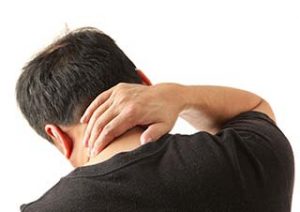 man holding neck in pain